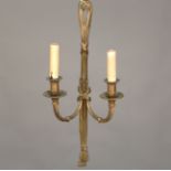 A set of four 20th century Neoclassical Revival cast brass twin-light wall sconces with ribbon
