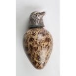 A late Victorian porcelain scent bottle of egg form, fitted with a silver chick's head screw lid,
