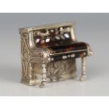 An Edwardian silver and tortoiseshell miniature novelty music box, finely modelled as an upright