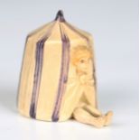 A scarce early 20th century novelty celluloid tape measure in the form of a bather poking their head