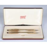 A Cross 14ct gold cased ballpoint pen and propelling pencil set, length 13.3cm, cased.Buyer’s