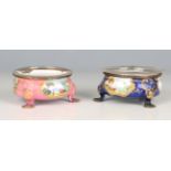 A pair of late 18th century Staffordshire enamel salts, each of circular form, painted with