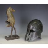 A 20th century green patinated cast bronze model of an ancient Greek horse, mounted on a hardstone