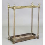 A late 19th century brass and cast iron twelve-division stick stand, height 63cm, width 50cm,