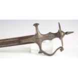A 19th century Indian tulwar with curved blade, blade length 70cm, with incised decoration, steel