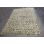 A signed Kashan carpet, Central Persia, mid/late 20th century, the celadon field with overall