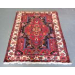 A Hamadan rug, North-west Persia, late 20th century, the charcoal field with a bold medallion,