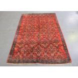 A Bidjar rug, North-west Persia, mid-20th century, the red field with an overall floral lattice,