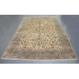 A large Kashan carpet, mid/late 20th century, the ivory field with overall scrolling tendrils,