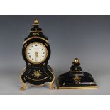 A mid-20th century Zenith ebonized mantel clock and bracket, the movement striking hours and half