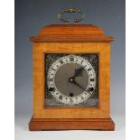 A 20th century walnut cased bracket style mantel clock by Perivale Clock Co, with eight day three