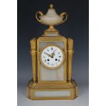 A late 19th century French ormolu and alabaster mantel clock with eight day movement striking on a