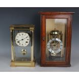A late 20th century lacquered brass cased four glass mantel clock with eight day movement striking