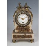 A late 19th century French ormolu mounted marble mantel timepiece with enamelled circular dial,