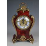 A late 19th century French gilt brass and tortoiseshell mounted mantel clock with eight day movement