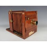 A late 19th century Husbands of Bristol mahogany folding plate camera with lacquered gilt brass