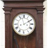 A late 19th century oak Vienna style wall clock with eight day movement striking on a gong, the