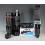 A collection of assorted camera lenses, including Tamron 1:4.5 70-350mm tele zoom lens, Tamron AF