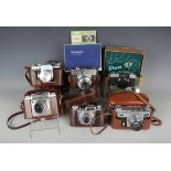 A collection of assorted cameras, including Canon Model VT camera with f:1.8 50mm lens,