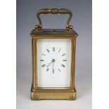 An early 20th century French lacquered brass cased carriage clock with eight day movement striking