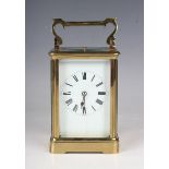 An early 20th century French lacquered brass cased carriage clock with eight day movement striking