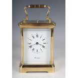 A mid to late 20th century gilt brass cased carriage clock with eight day movement striking hours