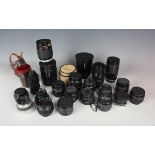 A collection of assorted camera lenses, including Tamron SP 500mm Tele Macro lens, Tamron 35-135mm