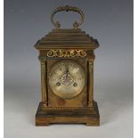 A late 19th/early 20th century French brass cased mantel clock, the eight day movement with platform