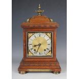 A late 19th century German brass mounted walnut mantel clock with eight day movement striking