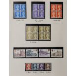A collection of Great Britain definitive stamps in an album, many in mint blocks of four plus high
