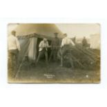 A collection of 29 postcards of First World War interest, including photographic postcards titled '