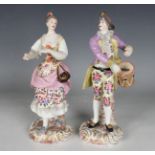A pair of Rudolstadt Volkstedt porcelain figures, late 19th century, modelled as a male drummer