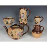 A Doulton Lambeth stoneware Slater's Patent three-piece tea service, late 19th century, decorated by