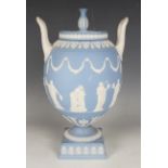 A Wedgwood pale blue jasperware two handled vase and cover, 20th century, the ovoid body sprigged