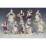 Eight Continental porcelain figures, 20th century, including a pair of street vendors by Sitzendorf,