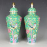 A pair of Herend Macao Green vases and covers, designed by Jeno Farkashazy, of tapered cylindrical