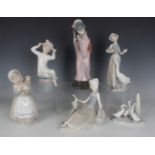 Four Lladro figures, comprising Timid Japanese, No. 4990, Girl with Hat, No. 1147, Shepherdess