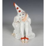 An Art Deco Rosenthal porcelain figure of a Pierrette, modelled by Constantin Holzer-Defanti, seated