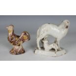 An English earthenware model of a chicken, circa 1790-1810, the cream glazed body with brown details