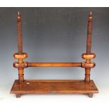 An early 20th century elm and fruitwood bookmaker's press by O. Friedheim, width 66cm, together with