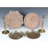 A group of Eastern brassware, including engraved trays, a vase and a pair of barley twist