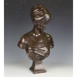 A late 20th century brown patinated moulded resin bust of a young woman, bearing signature 'Maquel',