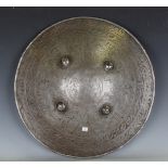 A 20th century Middle Eastern metal dha, the front decorated with figures and script, diameter 50cm,