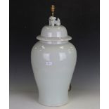 A 20th century Chinese porcelain table lamp with off-white glaze, modelled as a baluster vase and