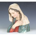 A mid-20th century polychrome painted plaster bust depicting the Madonna, height 40cm, width 34cm.
