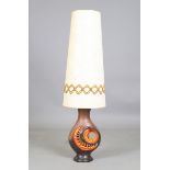 A 1970s style pottery table lamp, possibly West German, with a large conical shade, overall height