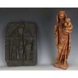 A 20th century carved elm figure group of the Madonna and Child, height 51cm, together with a carved