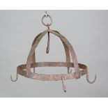 An 18th century wrought iron game crown, fitted with a suspension loop and six hooks, diameter