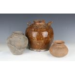 A pair of Chinese saltglaze stoneware water vessels of globular form with loop handle and spout,