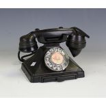 A GPO 200 series black Bakelite pyramid telephone, the underside detailed '1/232F FWR 56/2', width